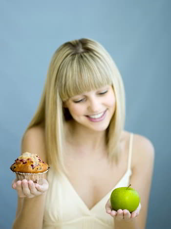 make the right choice - girl holding apple and cake