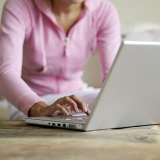 person working at laptop